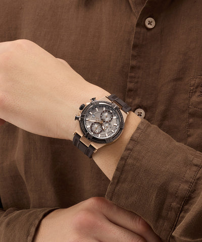 Close-up of a wrist wearing a detailed Gc IronForce Chrono Silicone with a brown shirt background