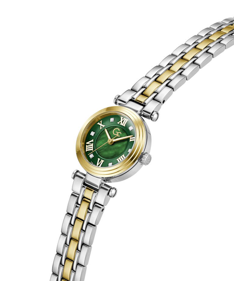 A women's two-tone watch with a green dial, gold-tone bezel and hands, and a silver-and-gold two-tone stainless steel link bracelet, shown on a plain white background. lifestyle
