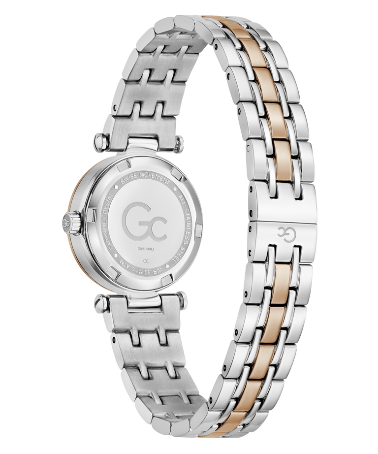 A women's stainless steel watch with a two-tone silver and rose gold link bracelet, shown from the back of the case. The dial is silver with a large 'GC' logo in the center, and the back case features a rose gold accent ring.