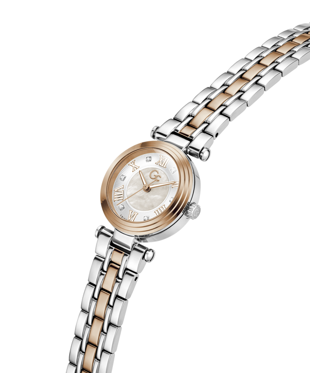A women's two-tone stainless steel and rose gold watch with a mother-of-pearl dial, shown on a clean white background. lifestyle