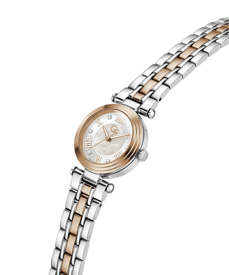 A women's two-tone stainless steel and rose gold watch with a mother-of-pearl dial, shown on a clean white background. lifestyle