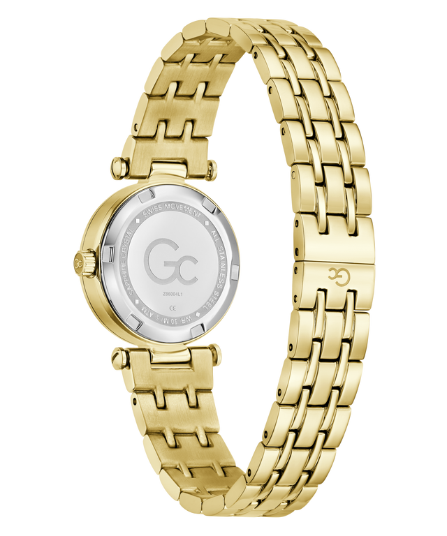 Gold-tone stainless steel women's watch with a multi-link bracelet and a silver-tone circular case back, shown on a plain white background.