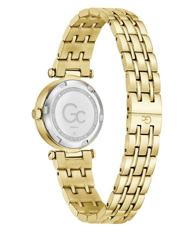 Gold-tone stainless steel women's watch with a multi-link bracelet and a silver-tone circular case back, shown on a plain white background.