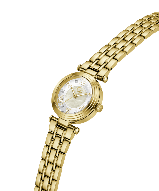 A gold-tone women's watch with a round mother-of-pearl dial, Roman numeral hour markers, crystal hour indices, and a matching gold-tone link bracelet, shown on a plain white background. lifestyle