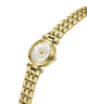 A gold-tone women's watch with a round mother-of-pearl dial, Roman numeral hour markers, crystal hour indices, and a matching gold-tone link bracelet, shown on a plain white background. lifestyle