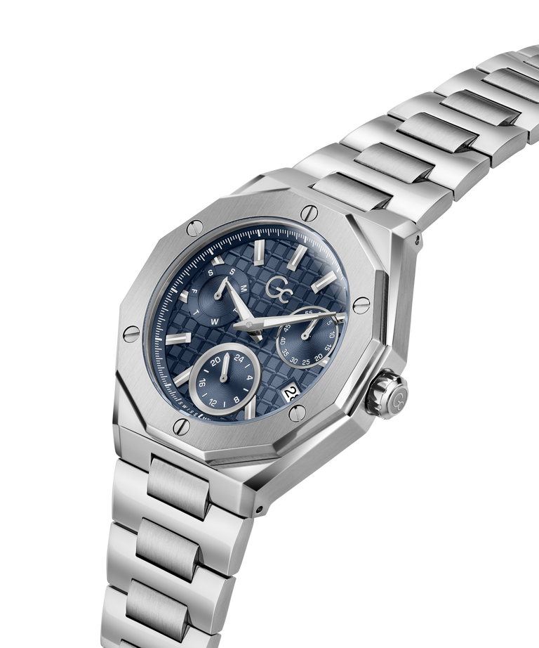 A silver stainless steel wristwatch with an octagonal bezel, a textured blue dial featuring three subdials, and a matching steel link bracelet, shown on a plain white background. lifestyle