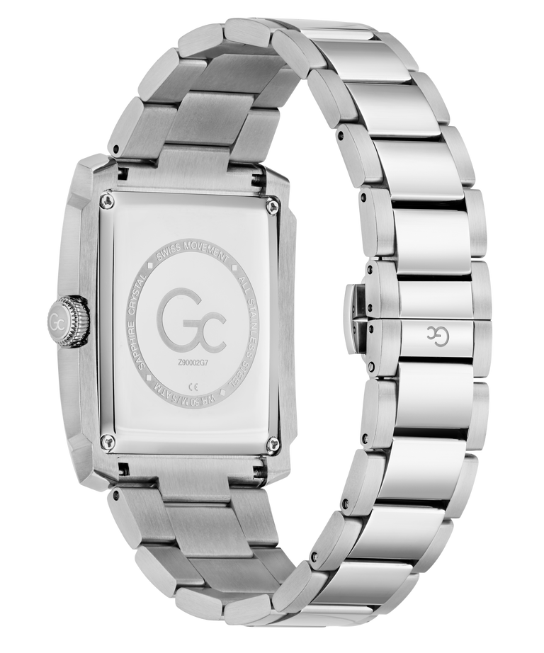 The back view of a stainless steel watch with a rectangular case and a matching metal link bracelet, featuring a brushed and polished finish. The dial is blanked out with a circular logo containing 'Gc' and 'TWENTYTHREE'.