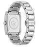The back view of a stainless steel watch with a rectangular case and a matching metal link bracelet, featuring a brushed and polished finish. The dial is blanked out with a circular logo containing 'Gc' and 'TWENTYTHREE'.