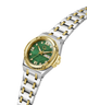 A two-tone stainless steel and gold wristwatch with a green dial, Roman numeral hour markers, a date window, and a matching two-tone link bracelet, shown on a plain white background. lifestyle