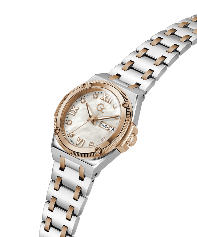A two-tone women's watch featuring a silver stainless steel link bracelet with rose gold accents, a round rose gold case, and a white mother-of-pearl dial with Roman numerals. lifestyle