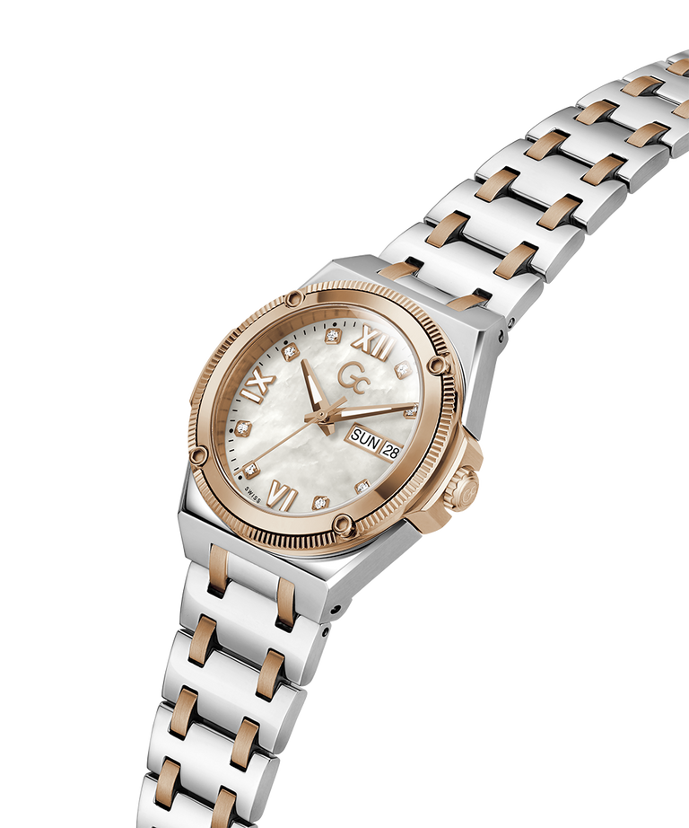 A two-tone women's watch featuring a silver stainless steel link bracelet with rose gold accents, a round rose gold case, and a white mother-of-pearl dial with Roman numerals. lifestyle