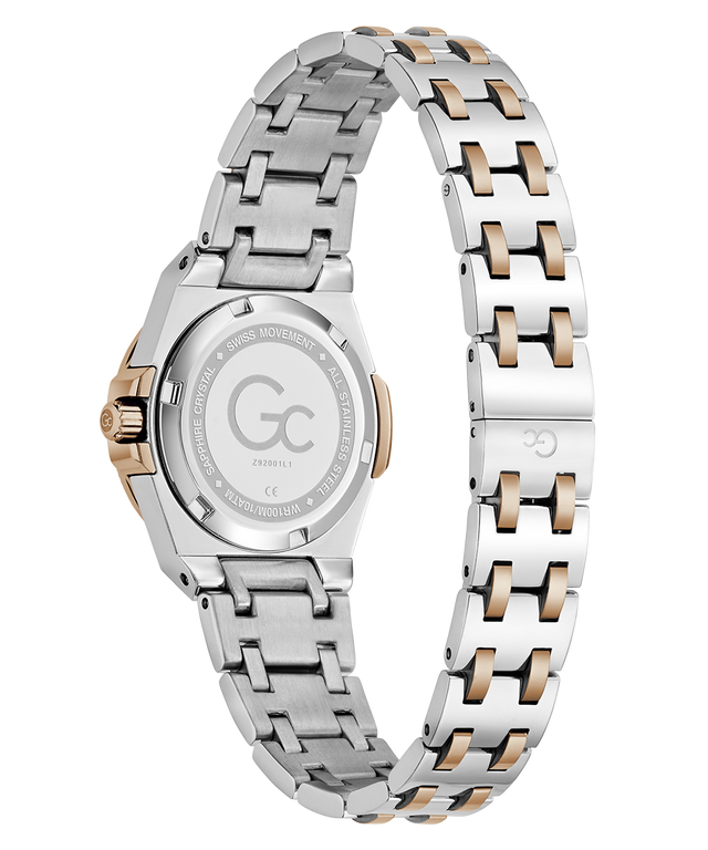 Two-tone stainless steel and rose gold women's watch shown from the back, featuring a matching link bracelet and a clear crystal case back with engraved details.
