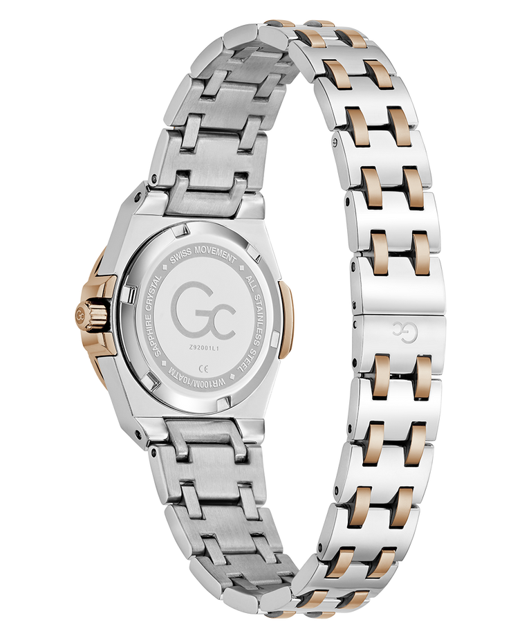 Two-tone stainless steel and rose gold women's watch shown from the back, featuring a matching link bracelet and a clear crystal case back with engraved details.