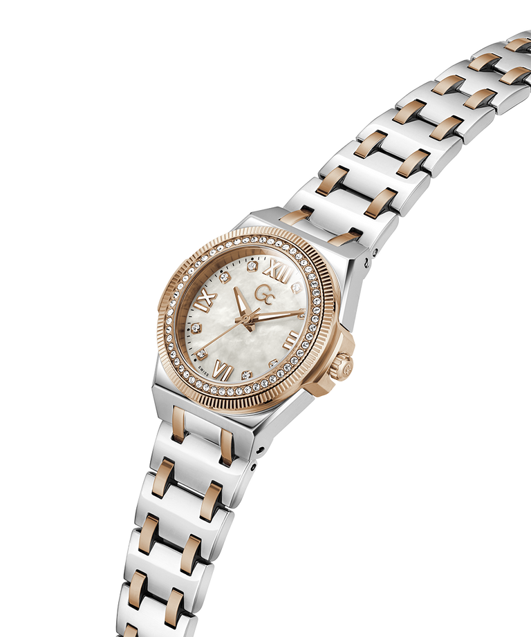 A two-tone stainless steel and rose gold watch with a mother-of-pearl dial, crystal-encrusted bezel, and matching link bracelet, shown on a plain white background. lifestyle