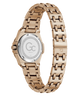 Rose gold women's watch with a stainless steel link bracelet, shown from the back on a white background. The back casing is transparent, revealing the brushed steel case and a silver-toned crystal backplate with a 'Gc' logo and technical specifications.