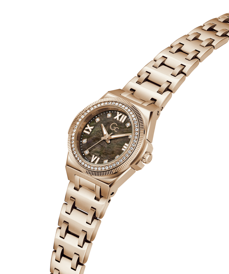 A rose gold women's watch featuring a textured green mother-of-pearl dial, a crystal-accented bezel, and a matching rose gold link bracelet, shown on a plain white background. lifestyle
