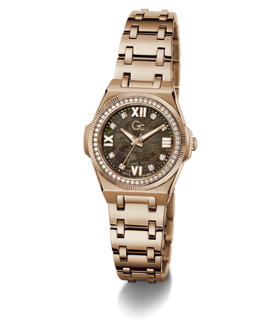 A women's rose gold-tone stainless steel watch with a round dial featuring a dark mother-of-pearl pattern, Roman numeral hour markers, a crystal gemstone bezel, and a matching rose gold link bracelet.