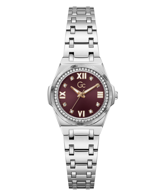 A women's stainless steel wristwatch with a silver-tone metal bracelet, a bezel set with small clear crystals, and a deep burgundy dial with gold-tone Roman numerals and hands.