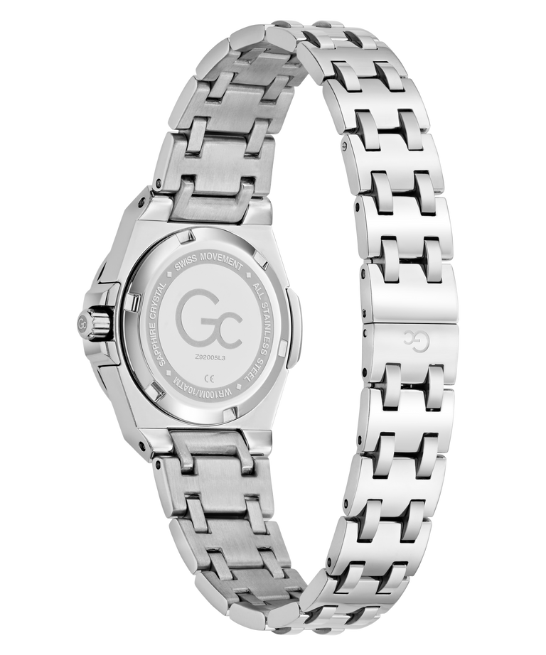 Silver stainless steel women's watch with a multi-link bracelet, shown from the back to display the brushed case back with a 'GC' logo and text.
