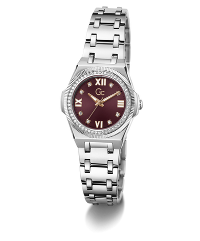 A women's stainless steel watch featuring a round silver-tone case, a bezel set with small clear crystals, a silver-tone link bracelet, and a deep burgundy dial with Roman numerals and gold-tone hands.