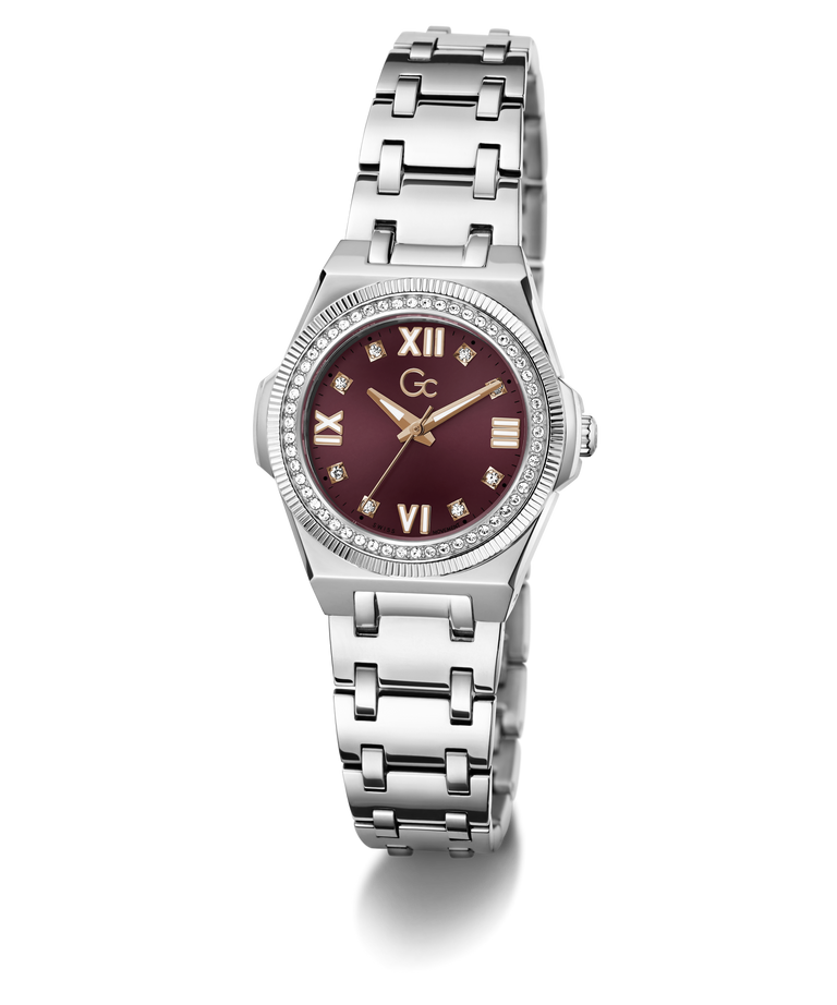 A women's stainless steel watch featuring a round silver-tone case, a bezel set with small clear crystals, a silver-tone link bracelet, and a deep burgundy dial with Roman numerals and gold-tone hands.