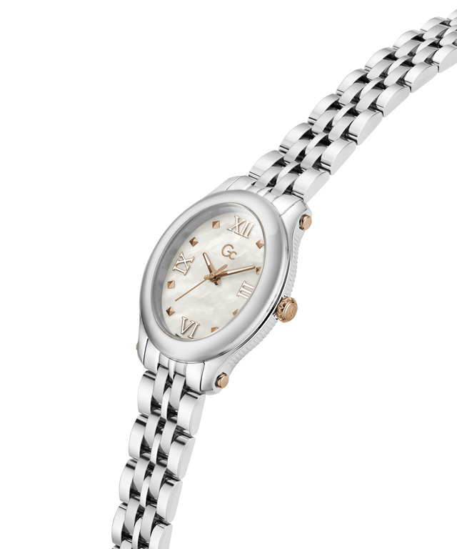 A women's oval wristwatch with a silver-tone metal link bracelet, a white mother-of-pearl dial, and rose gold-tone accents including the brand logo and hour markers. lifestyle