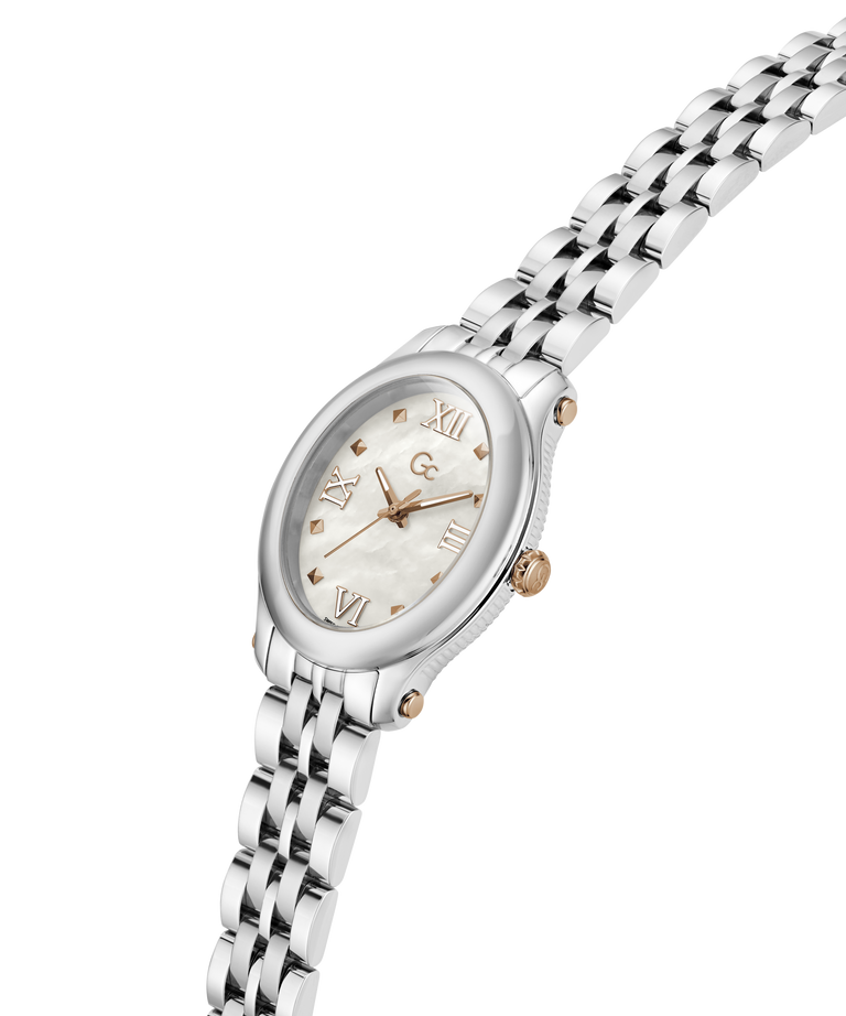 A women's oval wristwatch with a silver-tone metal link bracelet, a white mother-of-pearl dial, and rose gold-tone accents including the brand logo and hour markers. lifestyle
