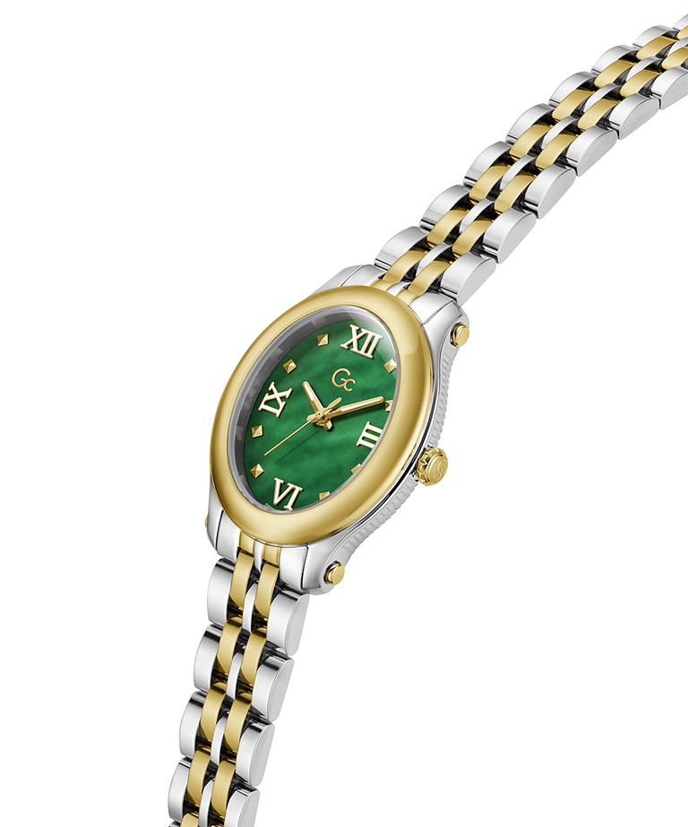 A women's oval watch with a two-tone silver and gold stainless steel link bracelet, a gold bezel, and a green dial with gold Roman numerals. lifestyle