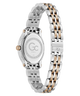 A two-tone stainless steel watch with a silver and rose gold link bracelet, shown from the back to display the case back and clasp, on a solid white background.