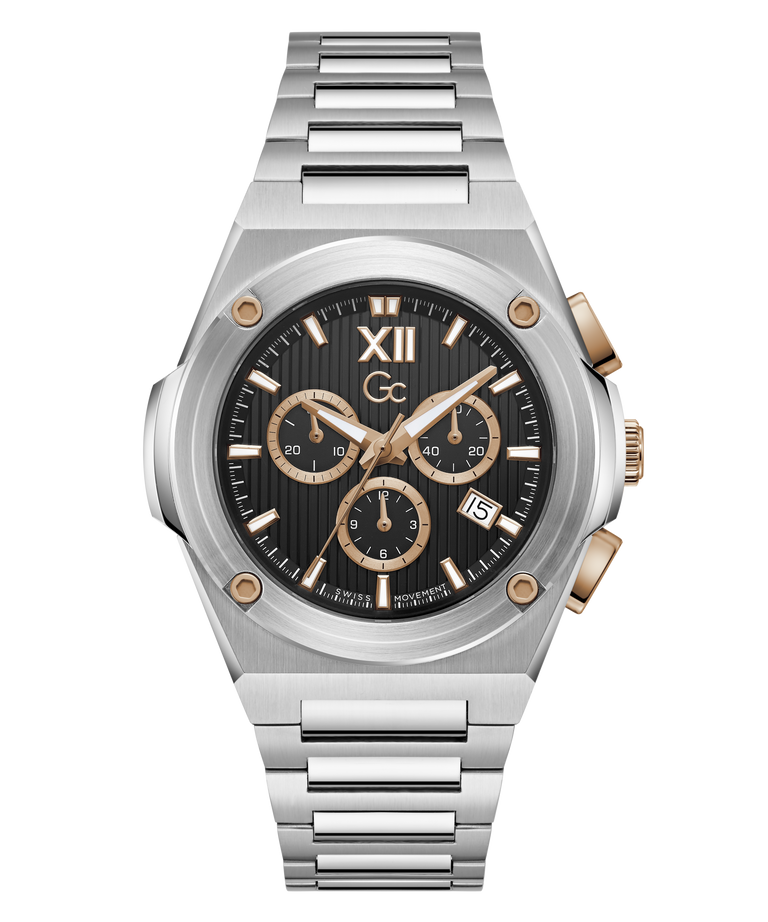 A luxury chronograph watch with a brushed silver-tone metal case and integrated link bracelet, featuring a black dial with gold-tone subdials, Roman numeral XII, and a date window.