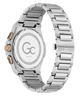 The back view of a Gc men's watch featuring a brushed stainless steel case and integrated link bracelet, with a gold-tone crown and pushers.