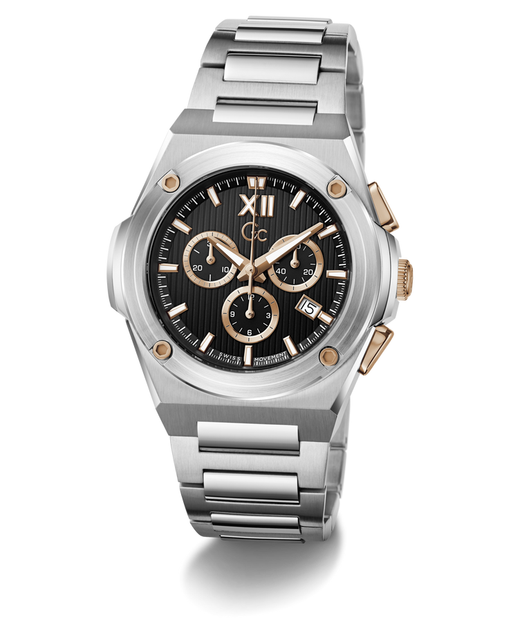 A stainless steel chronograph watch with a black dial, featuring gold-tone accents, Roman numeral XII, and a matching steel link bracelet, shown on a white background with a soft shadow.