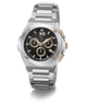 A stainless steel chronograph watch with a black dial, featuring gold-tone accents, Roman numeral XII, and a matching steel link bracelet, shown on a white background with a soft shadow.