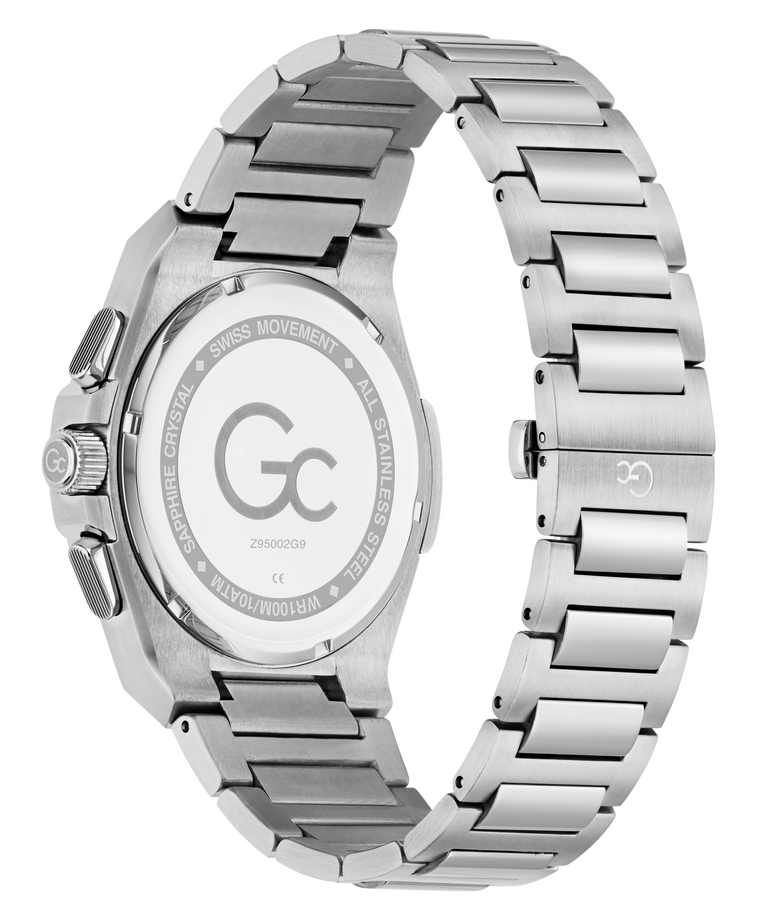 The back view of a G-Crown men's watch featuring a brushed stainless steel case and integrated link bracelet, with a gold-tone crown and pushers.