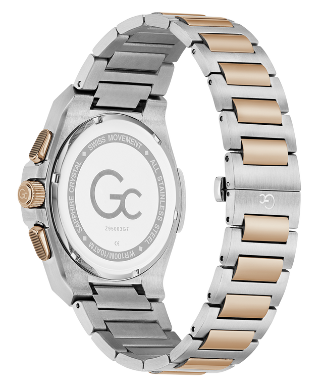 A close-up rear view of a wristwatch with a two-tone stainless steel and rose gold link bracelet, showing the engraved back case and crown.