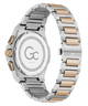 A close-up rear view of a wristwatch with a two-tone stainless steel and rose gold link bracelet, showing the engraved back case and crown.