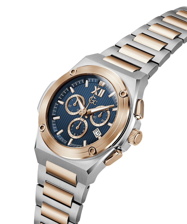 A men's two-tone stainless steel and rose gold chronograph watch with a blue dial, shown on a clean white background. lifestyle