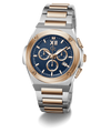 A two-tone stainless steel and rose gold chronograph watch with a blue dial, featuring Roman numeral XII on the watch face and a date window at 3 o'clock, set against a plain white background.