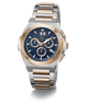 A two-tone stainless steel and rose gold chronograph watch with a blue dial, featuring Roman numeral XII on the watch face and a date window at 3 o'clock, set against a plain white background.