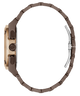 Side profile of a watch with a dark brown metal link bracelet, a rose gold-toned case, and a silver-toned folding clasp, shown on a plain white background.