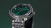 Video of silver womens watch with green dial