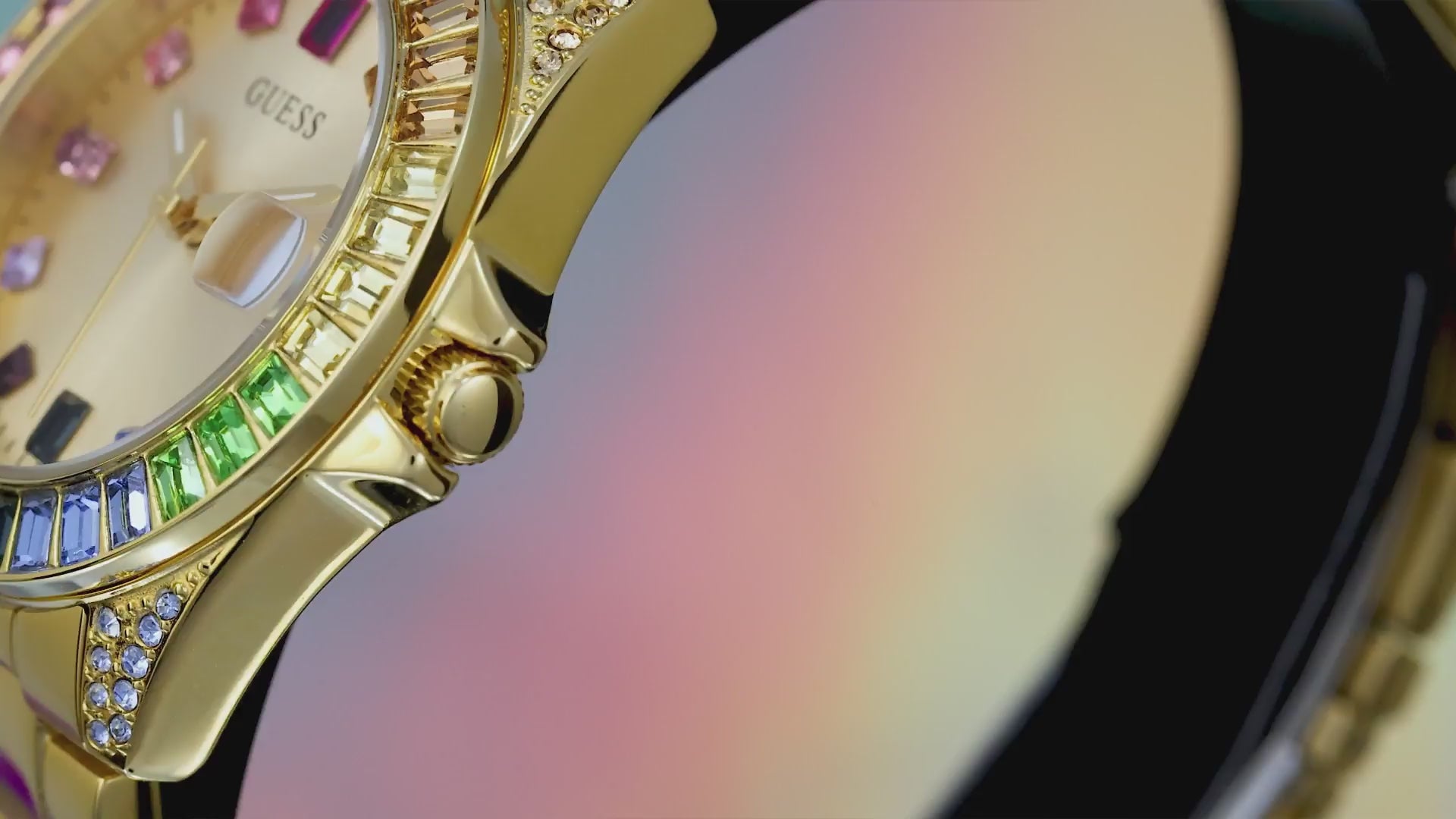 video of womens gold watch with rainbow crystals on bezel