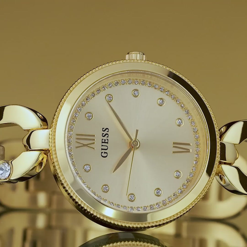 video of womens gold watch with stones on dial and logo shaped band